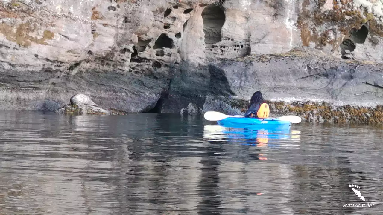 A Woman kayaking through the rocks in the lake - Nanaimo,  Vancouver Island